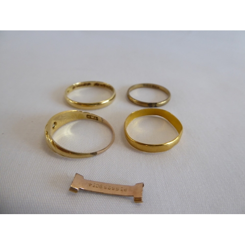 39 - 22ct gold wedding band (1.3g) and 3 other gold rings (5g)