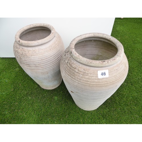 46 - Pair of ribbed terracotta amphora shape planters