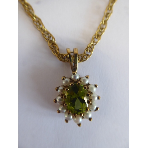 32 - 9ct gold peridot and seed pearl pendant on chain (6.3g)