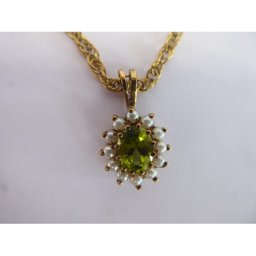 32 - 9ct gold peridot and seed pearl pendant on chain (6.3g)
