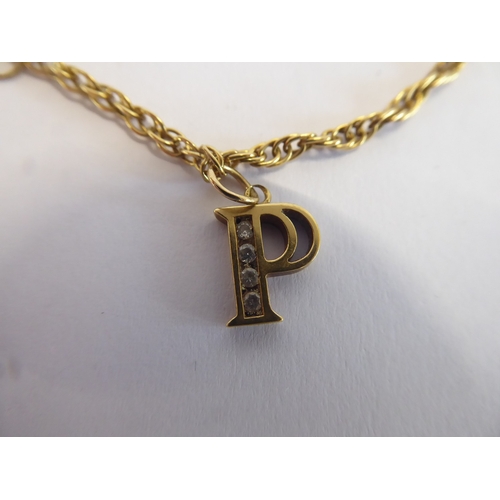 38 - 18ct gold diamond set 'P' pendant on 18ct chain (8g)