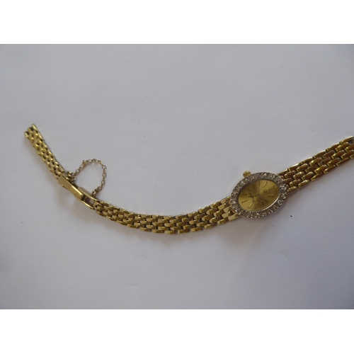 55 - Woodford 14ct gold and diamond cased ladies wristwatch (broken strap)
