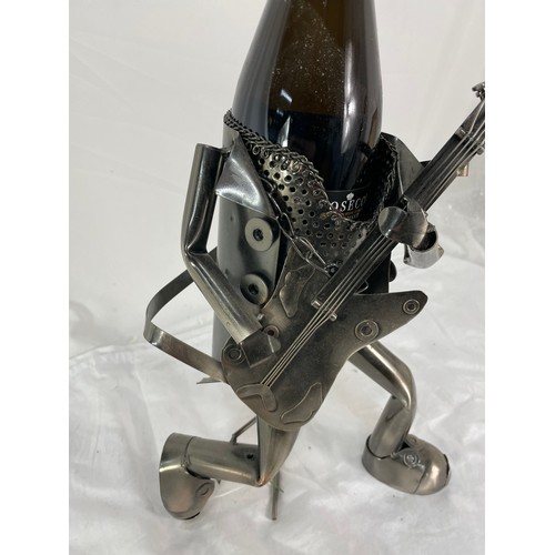 265 - Metal Figure (Guitar Player) Bottle Holder Inc Bottle Of Prosecco.