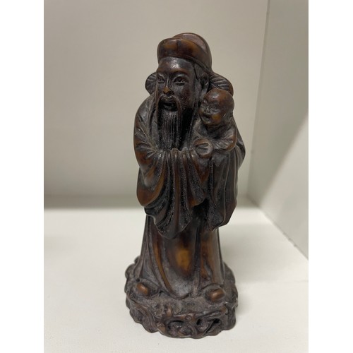 202 - Resin Chinese Man Holding A Baby