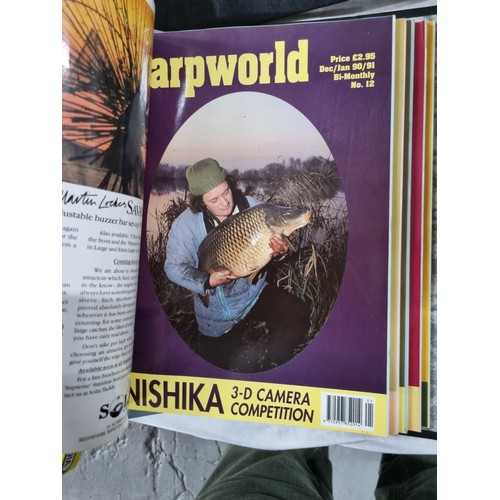 108 - 32 copies of Carp World magazine in binders