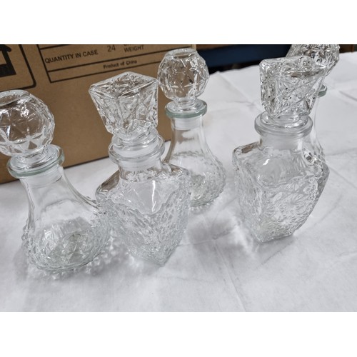 145 - 2 x Boxes of 24 decorative decanters