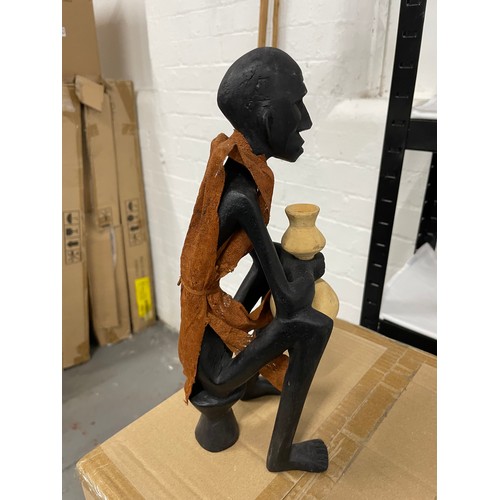 116 - Hand Carved African Wood Figure Of A Man Resting With His Water