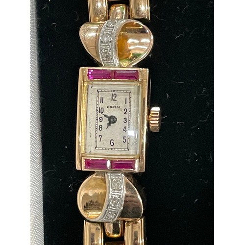 169 - Vintage Norma 18k Gold, Ruby & Diamond Ladies Watch.
18k Gold Bracelet & Case 14mm x 20mm. Diamond D... 