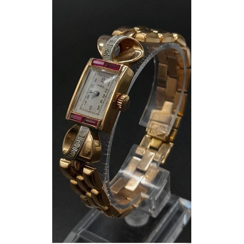 169 - Vintage Norma 18k Gold, Ruby & Diamond Ladies Watch.
18k Gold Bracelet & Case 14mm x 20mm. Diamond D... 