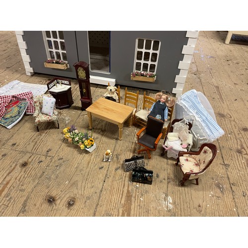 242 - Four storey wooden dolls house with, Steps, lighting, conservatory, band stand, and other accessorie... 