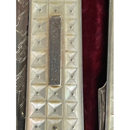 220 - A fine George III cased campaign mother of pearl folding fruit knife and fork, with the knife carved... 