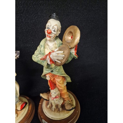 270 - Collection of Clown figurines and clock.