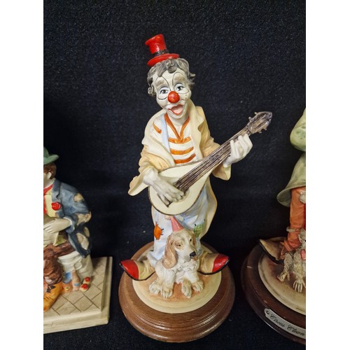 270 - Collection of Clown figurines and clock.