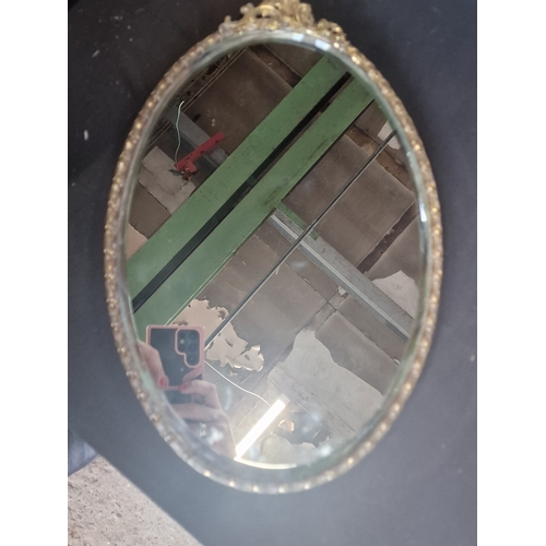 1 - A vintage Ornate Oval Gilt mirror