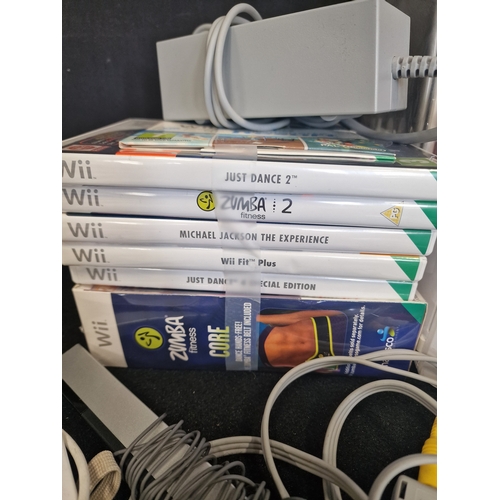90 - WII console with Zumba core fitness (sealed) and games
Tested and working