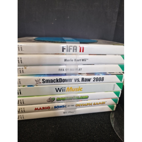 91 - A bundle of 10 WII games and console