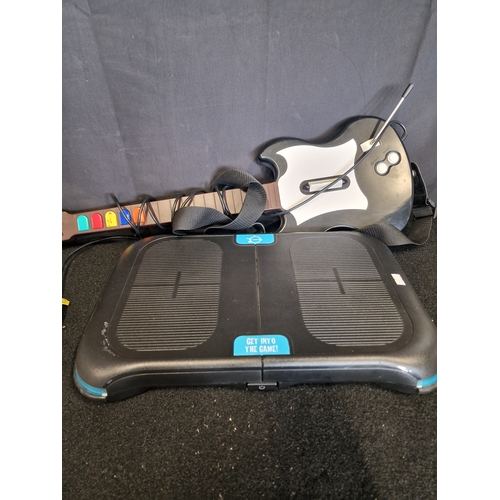92 - A Game-on balance board and redoctane gaming guitar
