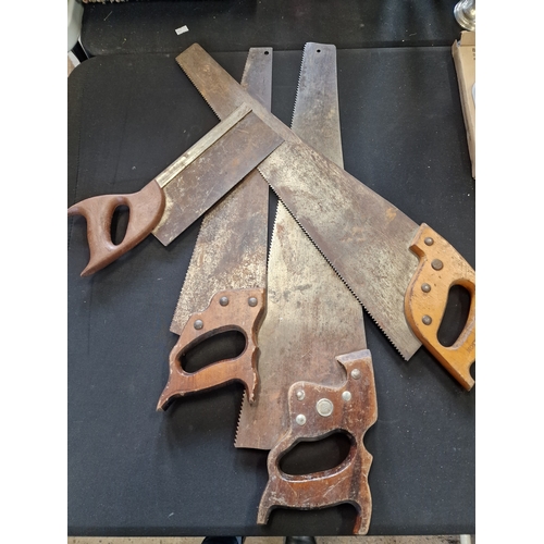 102 - Four vintage hand saws