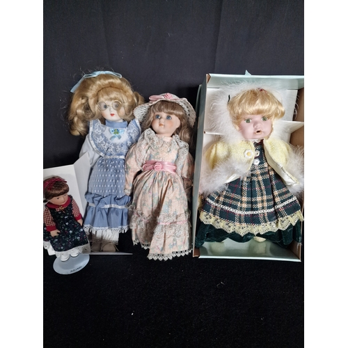 115 - Four collectable Porcelain dolls including DeMarco