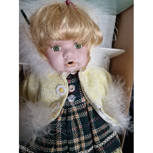 115 - Four collectable Porcelain dolls including DeMarco