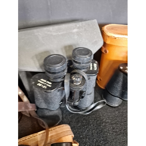 129 - Four pairs of vintage binoculars with original cases and Lens Caps