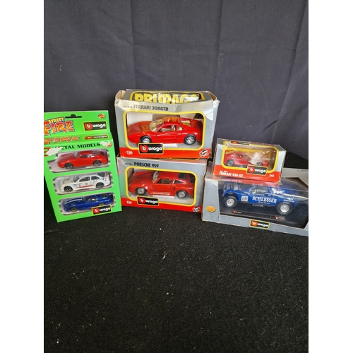 143 - A collection of Burago cars boxed. Including porsche 959, ferrari 308gtb & 456 GT