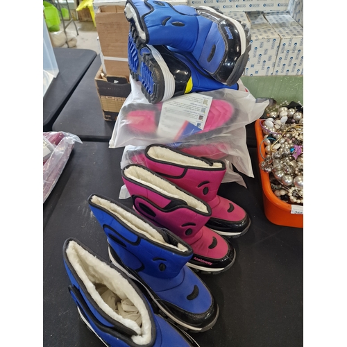 144 - 6 pairs of snow boots various sizes Pink and Blue.