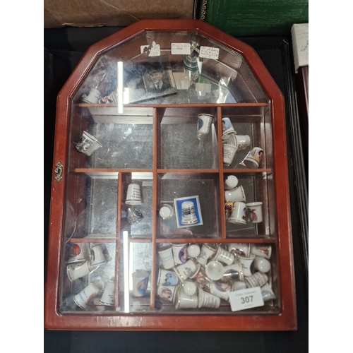 307 - A vast selection of thimbles and display case