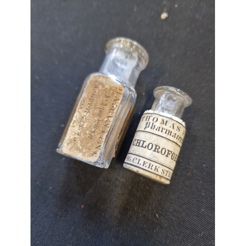 128 - Two small vinatge medicine bottles including Chloroform