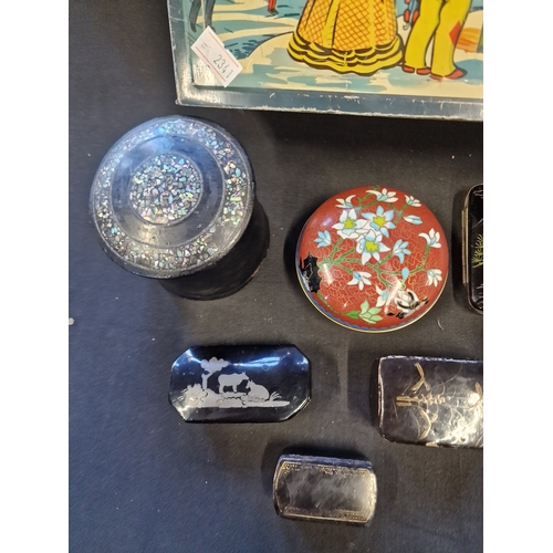 131 - A selection of trinket and pill boxes and tins.