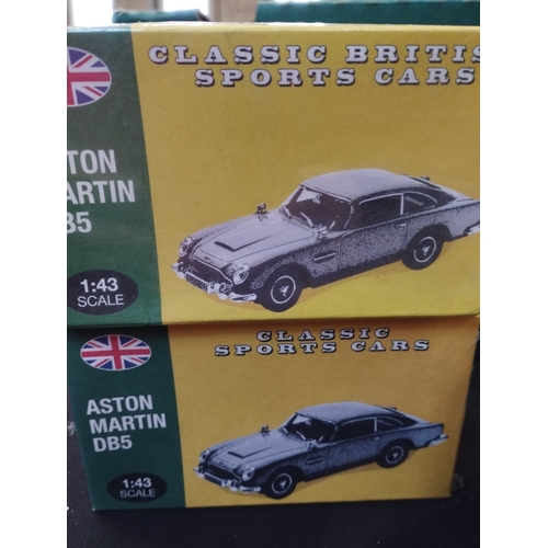 139 - Vintage Atlas 1:43 Classic British Sports Cars. x2 Aston Martin DB5's and a Jaguar E-Type