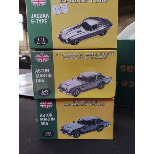 139 - Vintage Atlas 1:43 Classic British Sports Cars. x2 Aston Martin DB5's and a Jaguar E-Type