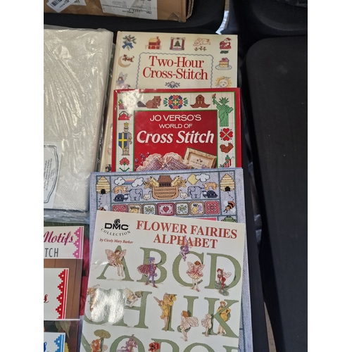 160 - A bundle of cross stitch items, frames, material, cotton and design books