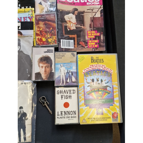 172 - A large collection of the Beatles memorabilia including 13 45's, the fab four calander, the deathles... 