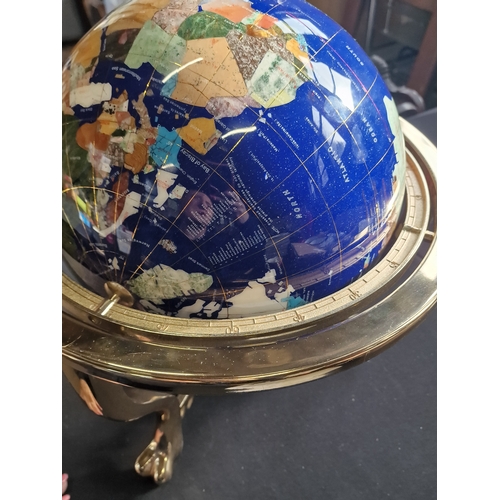 228 - A unique Blue Lapis stone ocean and Gemstone globe, with brass finish tri stand