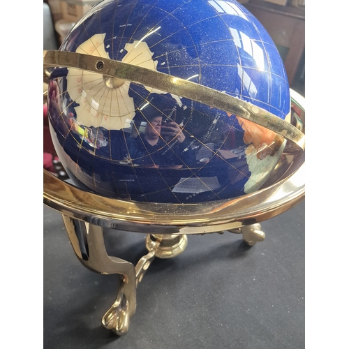 228 - A unique Blue Lapis stone ocean and Gemstone globe, with brass finish tri stand