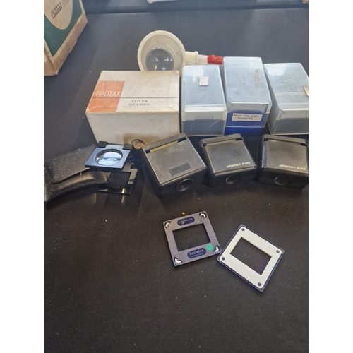 250 - A selection of slide mounts and glass slides and UNOMAT D-100 magnifiers