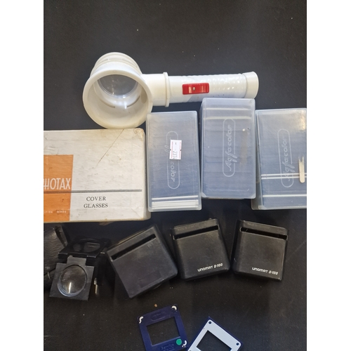 250 - A selection of slide mounts and glass slides and UNOMAT D-100 magnifiers