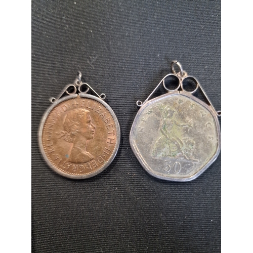 332 - Two mounted coins.  1967 Old penny and an old 1969 50 pence peice.