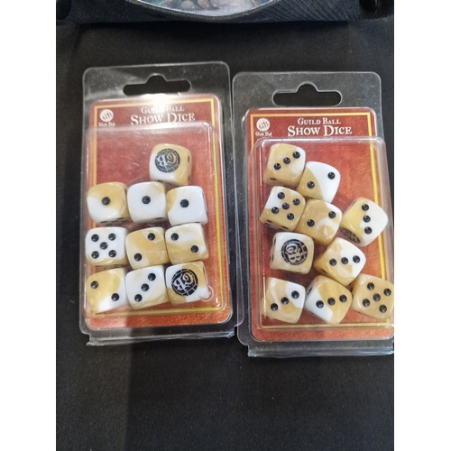 391 - steamforge guild ball set of 7 pin badges, two sets of show dice and a fabric dice mat/tray