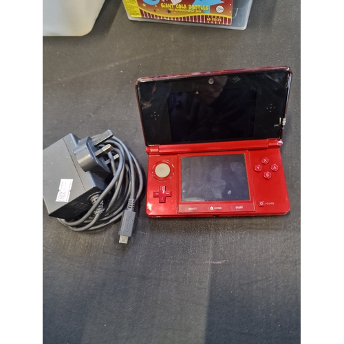 51 - Nintendo DS3 in Red with charger.  Tested for power