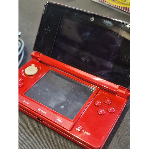 51 - Nintendo DS3 in Red with charger.  Tested for power