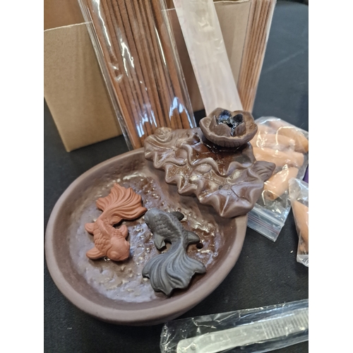 66 - Two fish ceramic waterfall backflow incense holder with backflow incense cones and incense sticks.