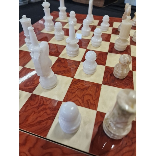 68 - Chess board with Onyx pieces