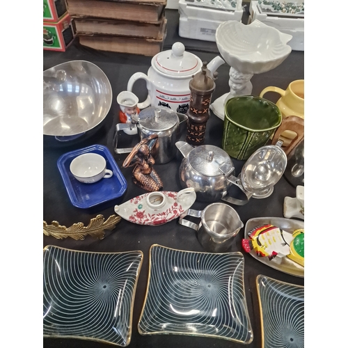 69 - A mix lot of stainless kitchen ware, pottery and chance glass