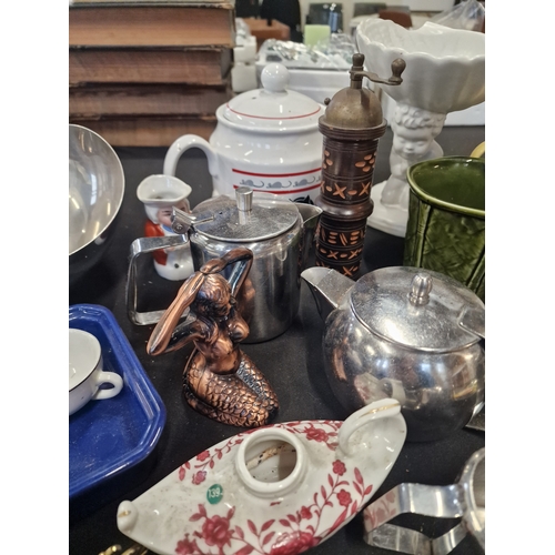 69 - A mix lot of stainless kitchen ware, pottery and chance glass