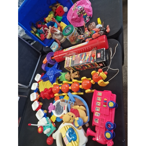 73 - A collection of vintage toys including Tomy and playschool