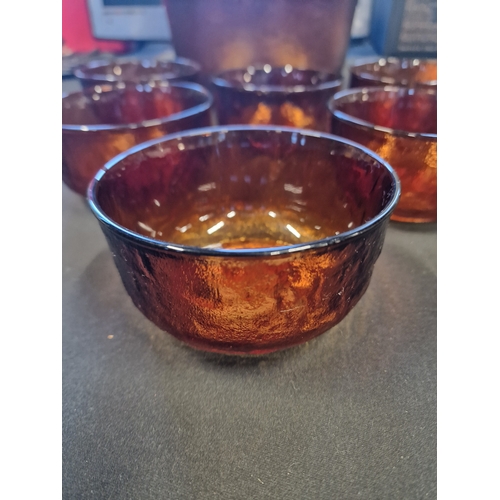 76 - A large vintage amber glass punch bowl with 6 serving glasses/bowls