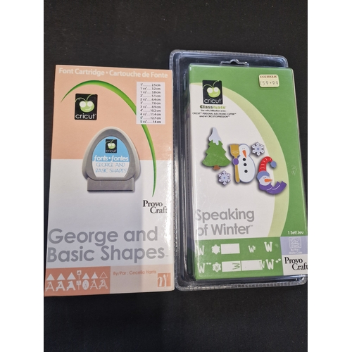 94 - Cricut font cartridges. George and basic shapes and speaking winter which is new and sealed