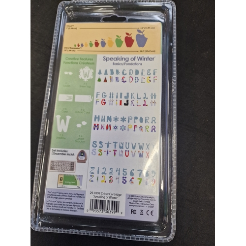 94 - Cricut font cartridges. George and basic shapes and speaking winter which is new and sealed